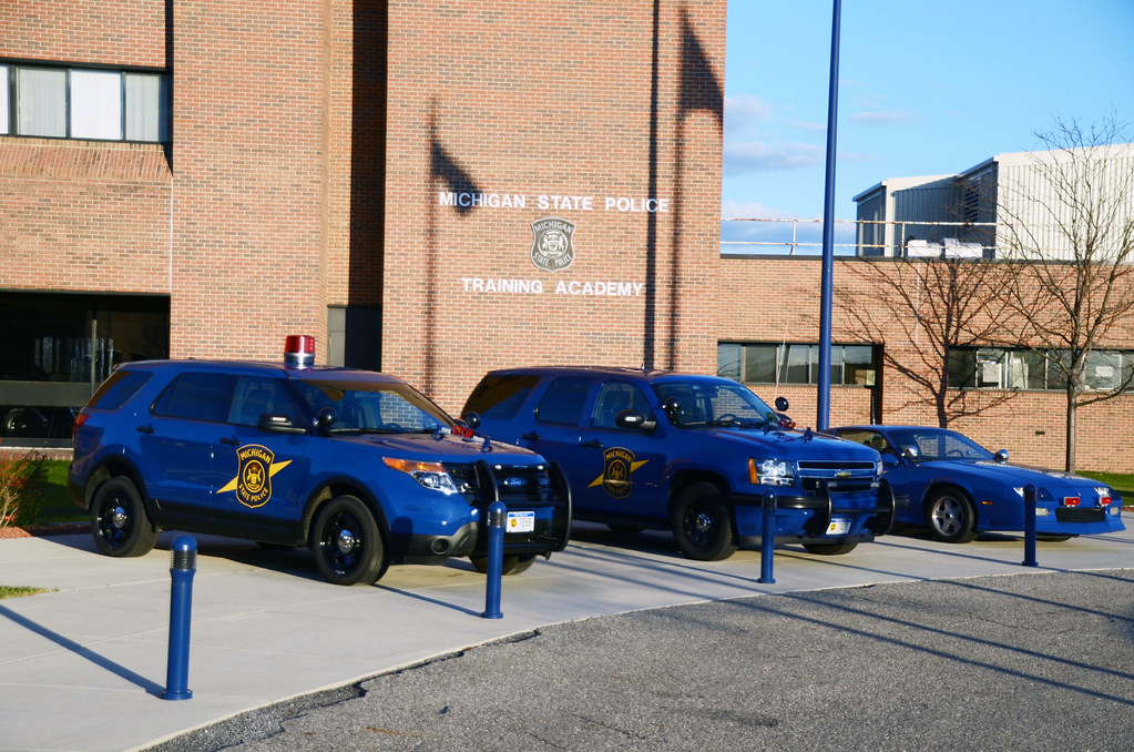 Michigan State Police cars in front of Training Academy